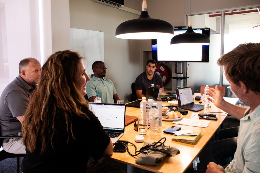 The AskMandla team working together at the table